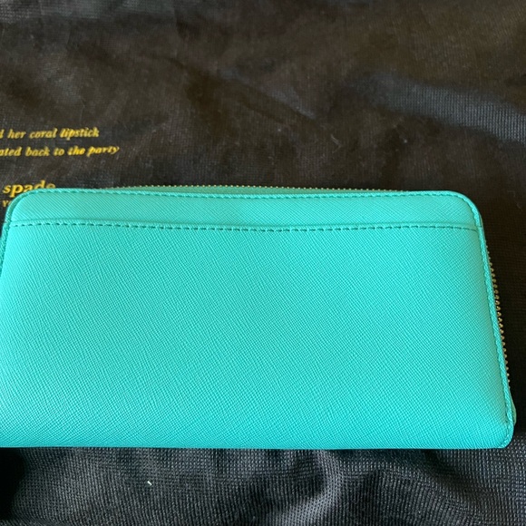 Kate spade tote with inside zipper pocket and two pockets on other side. - Picture 11 of 14